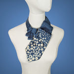 Load image into Gallery viewer, sapphire blue pleated ascot with small cream flowers on the lower half of the ascot
