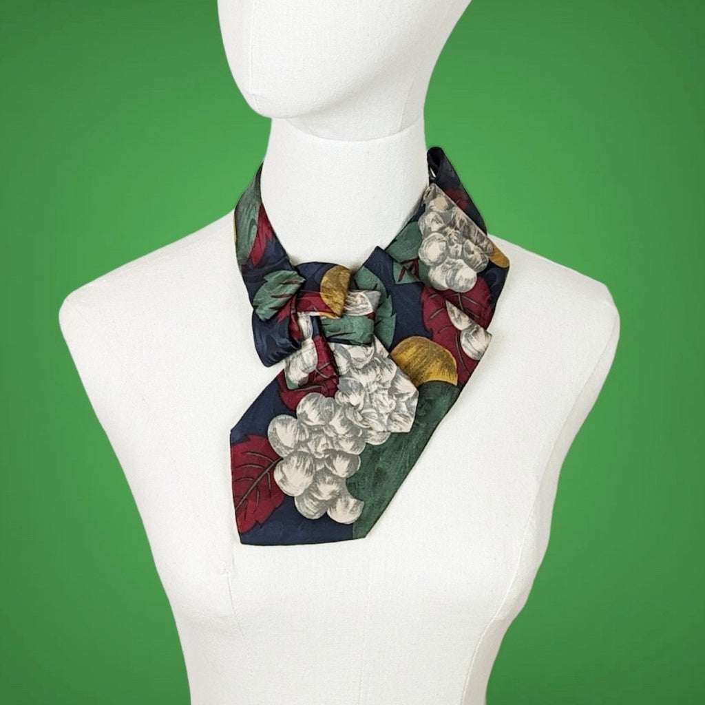 ascot scarf in muted fall colors of wine, gold, green and grey with a print of leaves and berries