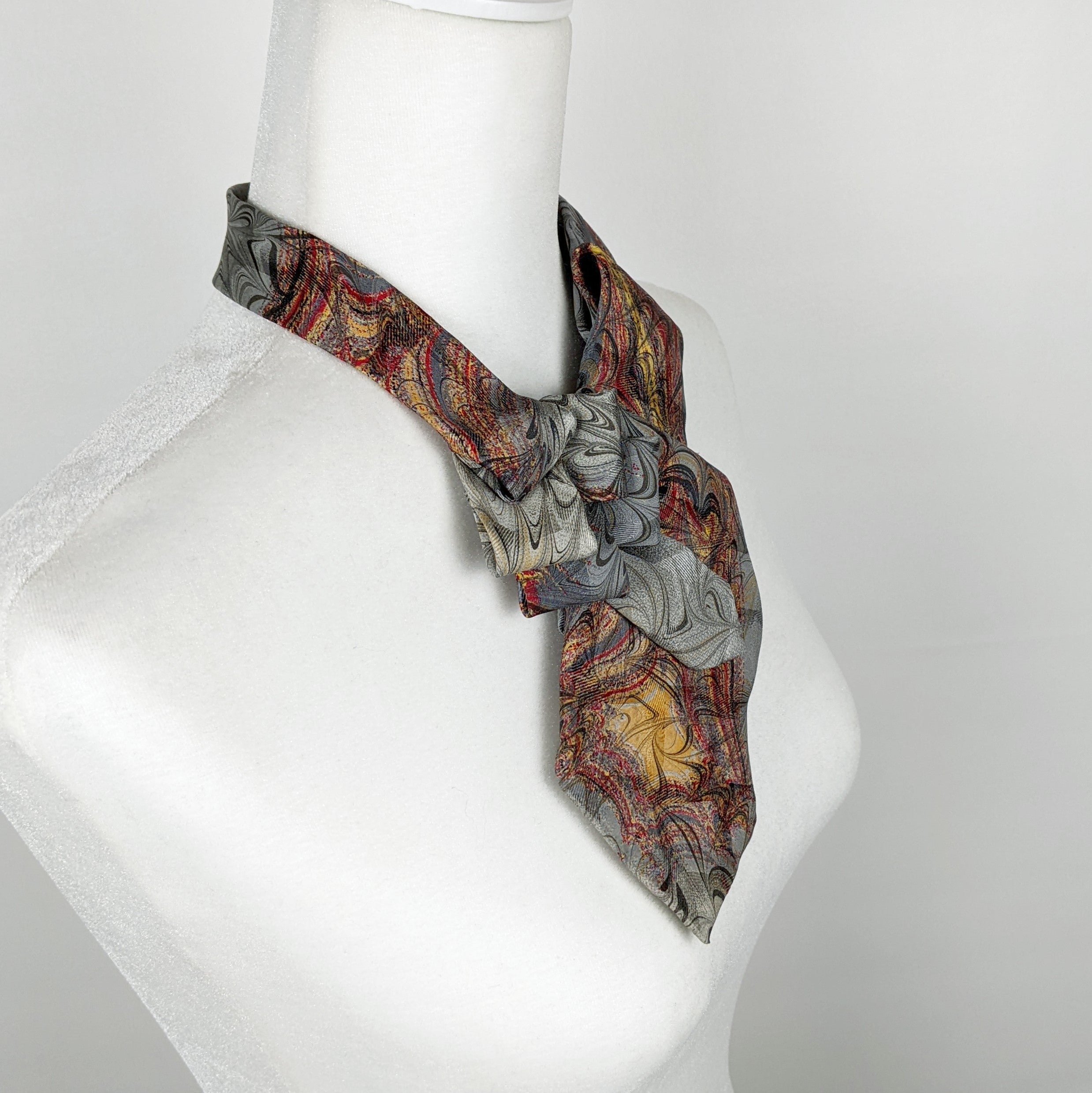 Ascot Scarf In A Grey, Gold And Red Marbled Print