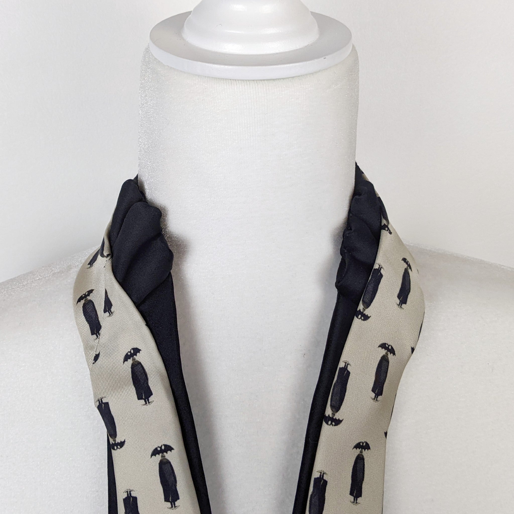 Double Necktie In black And Cream With A Print Of A Man