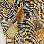 Load image into Gallery viewer, Ascot Scarf In Retro 60&#39;s Black And Gold Print.
