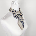 Load image into Gallery viewer, Ascot Scarf In Sand and Navy Flowers and Pixies Print
