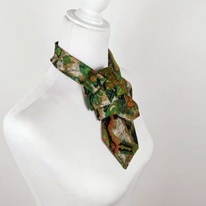 Ascot Scarf In A Green, Orange And Brown Print.