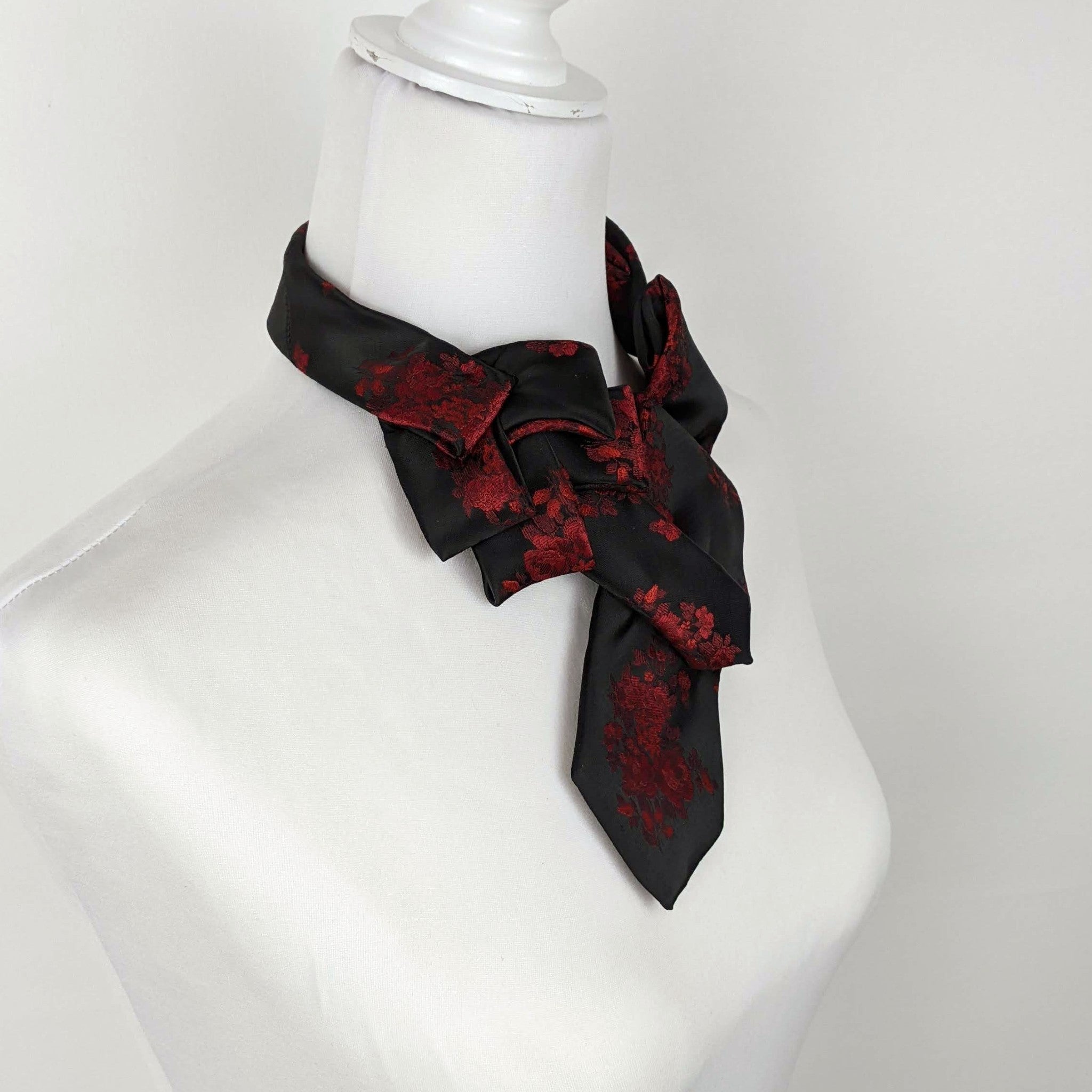 Women's Skinny Black Ascot Scarf With A Red Rose Print.
