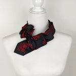 Load image into Gallery viewer, Women&#39;s Skinny Black Ascot Scarf With A Red Rose Print.
