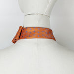 Load image into Gallery viewer, Scarf In Orange With A Blue Flamingo Print.

