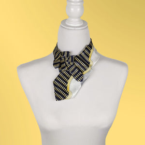 Ascot Scarf In An 80's Print In A Navy, Yellow, White And Grey.