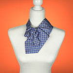 Load image into Gallery viewer, Women&#39;s Ascot Scarf In Sky Blue With Blue And Orange Foulard Print.
