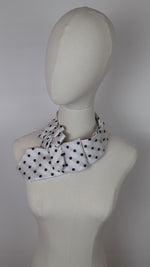 Load and play video in Gallery viewer, Ascot Scarf In White With A Black Polka Dot Print.
