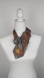 Load and play video in Gallery viewer, Ascot Scarf In A Grey, Gold And Red Marbled Print
