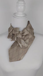 Load and play video in Gallery viewer, Ascot Scarf In A Beige Argyle Print
