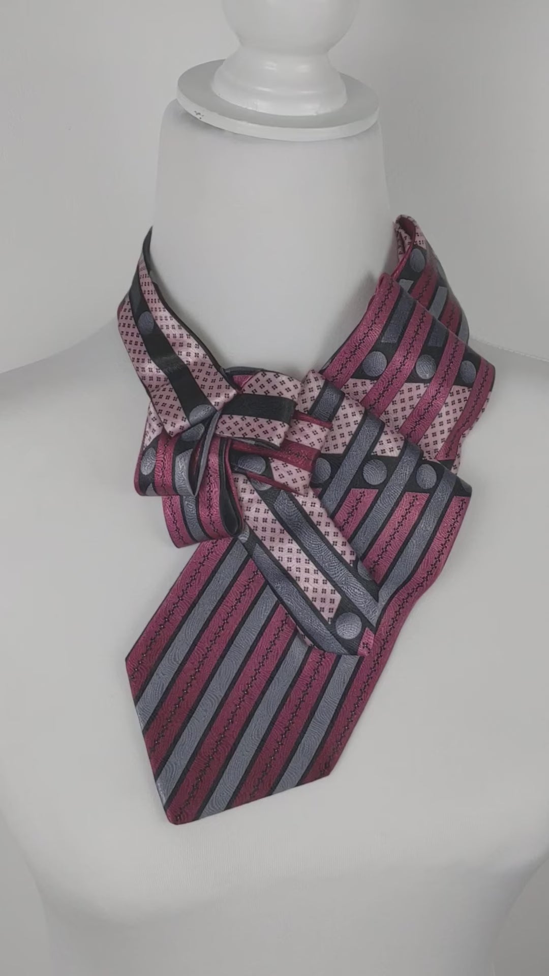 Ascot Scarf In A Pink And Grey Striped Print.