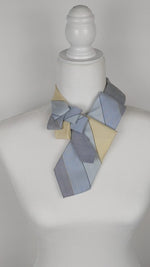 Load and play video in Gallery viewer, Women&#39;s Skinny Ascot Scarf In Retro Blue And Yellow Print.
