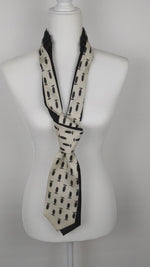Load and play video in Gallery viewer, Double Necktie In black And Cream With A Print Of A Man
