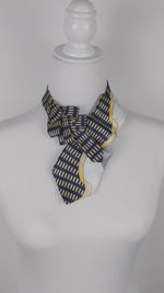 Load and play video in Gallery viewer, Ascot Scarf In An 80&#39;s Print In A Navy, Yellow, White And Grey.
