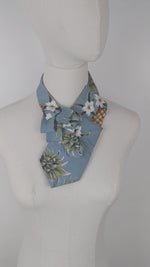 Load and play video in Gallery viewer, Ascot Scarf In A Blue Hawaiian Print
