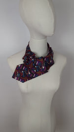 Load and play video in Gallery viewer, Ascot Scarf In A Multi-Colored Tribal Print
