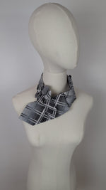 Load and play video in Gallery viewer, Ascot Scarf In A Black, White And Grey Retro Print.
