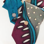 Load image into Gallery viewer, Ascot Scarf In Teal ,Grey And  Plum Abstract Print.
