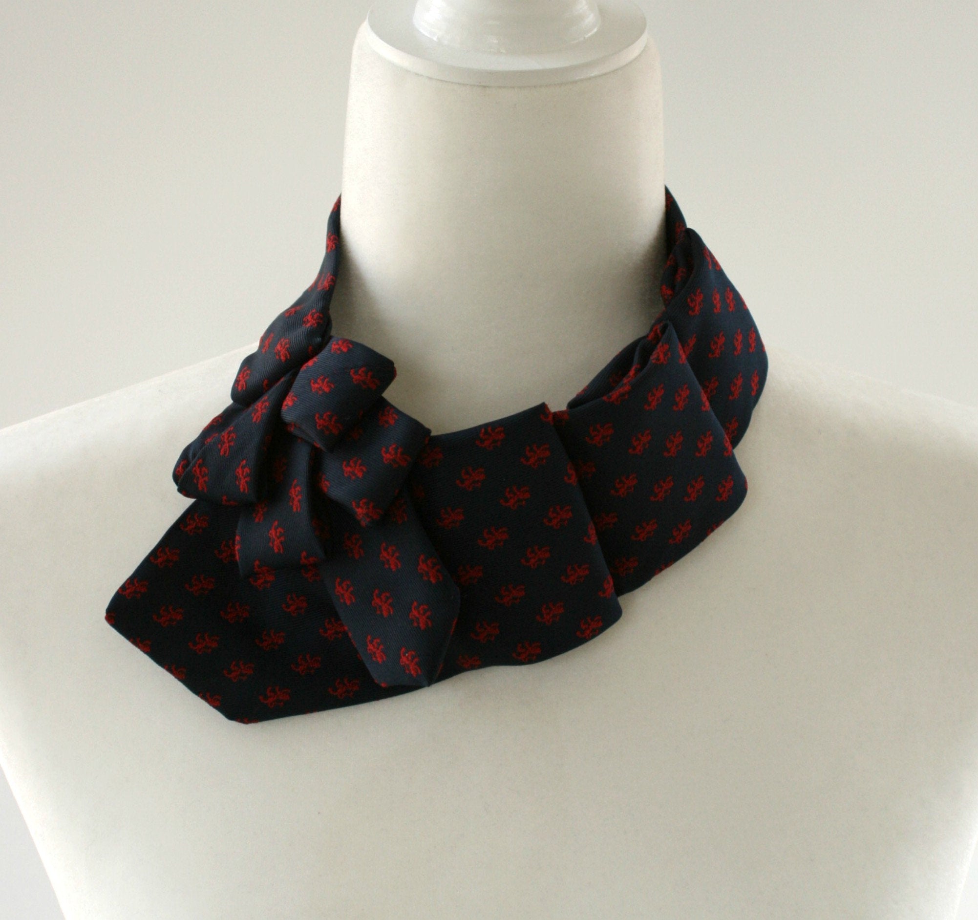 Women's Ascot Scarf In Navy With Lion Crest Print.